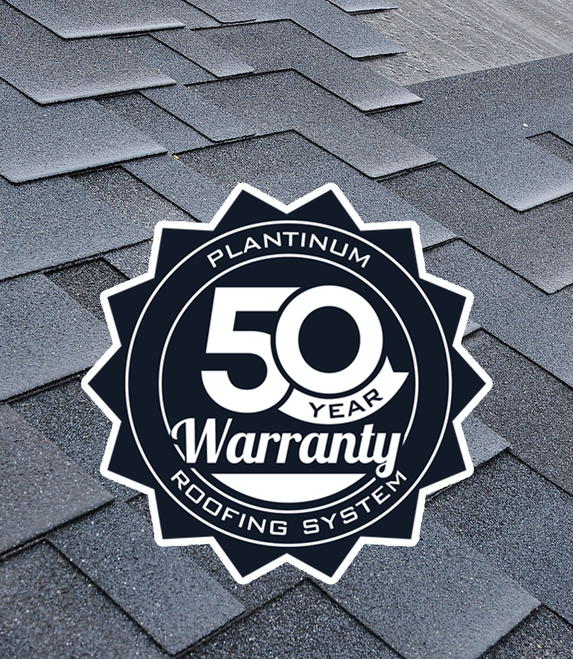 50-year platinum warranty badge on gray asphalt shingles roofing system background